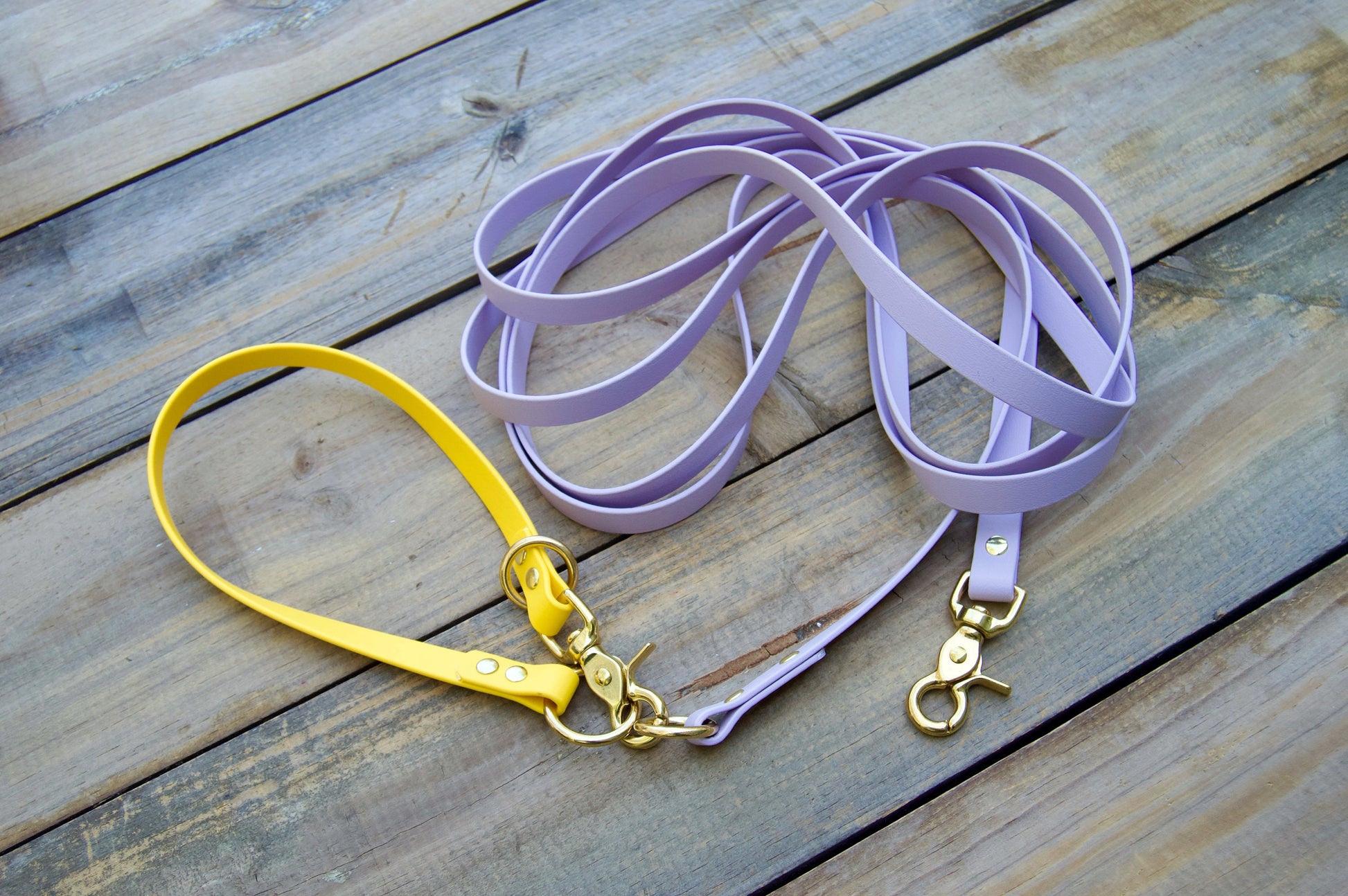 Waterproof Long line dog leash shown in lilac and yellow