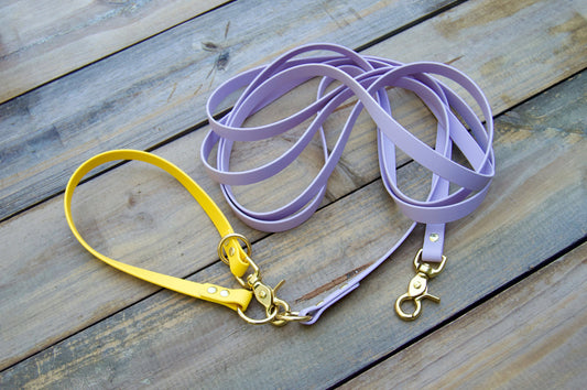 Waterproof Long line dog leash shown in lilac and yellow