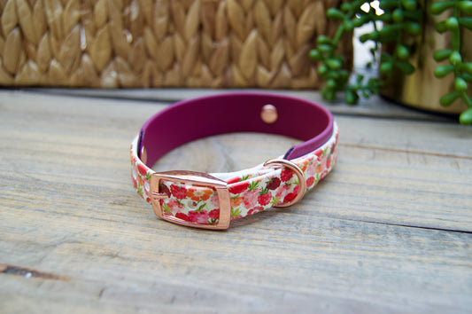 raspberries patterned dog collar with a rose gold buckle on a wooden surface.